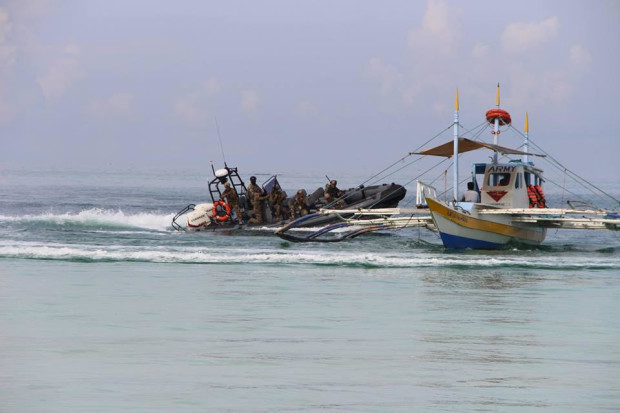 The Philippine Coast Guard, Navy and the National Police Maritime Group simulate sea defense and counter-attack in case of terrorists attacking Boracay Island, on May 22, 2017. (Photo courtesy of the Boracay Tourist Assistance Center)