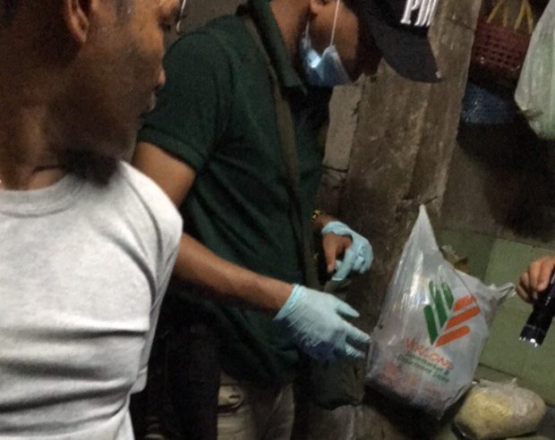 PDEA agent inspects illegal drugs confiscated drug den subic