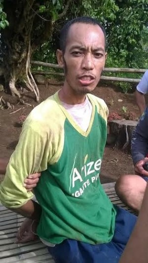 Suspected Abu Sayyaf man Saad Samad Kimir, alyas Abu Saad, was arrested in Tubigon, Bohol, on May 4, 2017. A .45-gun, two magazines and a cellphone were seized from Saad. (Photo contributed to the Inquirer Visayas)