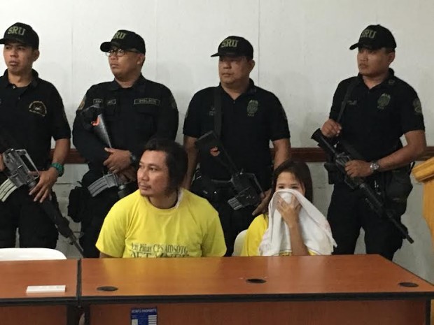 Members of the National Capital Region Police Office, the Taguig City Police and the Las Pinas City Police present suspected Martilyo Gang leader Sulayman Dimapuro and his partner, drug pushing suspect, Warda Alamada, on May 11, 2017, to the media. (PHOTO BY DEXTER CABALZA / INQUIRER)