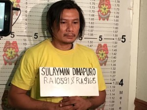 Suspected Martilyo Gang leader Sulayman Dimapuro's mugshot is taken by the police on May 11, 2017 (PHOTO BY DEXTER CABALZA / INQUIRER)