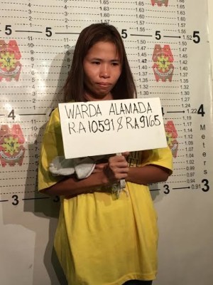  Warda Alamada, who accompanied her husband, suspected Martilyo Gang leader Sulayman Dimapuro, in his drug transactions, faces the police for her mugshot on May 11, 2017. (PHOTO BY DEXTER  CABALZA / INQUIRER)