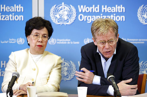 FILE - In this Tuesday, March 29, 2016 file photo, Margaret Chan, left, General Director of the World Health Organization (WHO) and Bruce Aylward, right, Executive Director of WHO and Health Emergencies Director-General's Special Representative for the Ebola Response, speak to the media after The International Health Regulations Emergency Committee on Ebola, during a press conference, at the WHO headquarters in Geneva, Switzerland. The World Health Organization routinely spends about $200 million a year on travel, far more than what it doles out to fight some of the biggest problems in public health including AIDS, tuberculosis and malaria, according to internal documents obtained by The Associated Press, published Sunday, May 21, 2017. (Salvatore Di Nolfi/Keystone via AP, File)