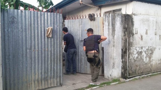 Authorities raid the house of the brother of a former DILG official in Talisay City, BENJIE TALISIC/CEBU DAILY NEWS