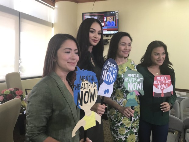 Senator Risa Hontiveros is flanked by supporters of the mental health bill, actress Antoinette Taus, Miss International Kylie Versoza and Jerika Ejercito. CHRISTINE AVENDANO/PHILIPPINE DAILY INQUIRER