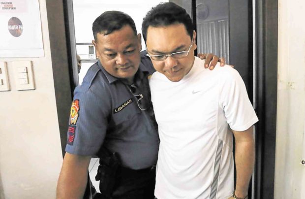 Bohol Provincial Board Member Niño Rey Boniel is escorted back to his detention cell in Cebu City hours before he is transferred to a jail facility in Bohol nearer his hometown in Bien Unido. —JUNJIE MENDOZA/CEBU DAILY NEWS