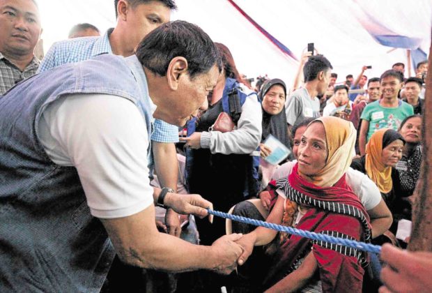 President Duterte visits evacuees inside a tent at Iligan City National School of Fisheries, which was used for the President’s interaction with the Marawi City residents. —MALACAÑANG PHOTO