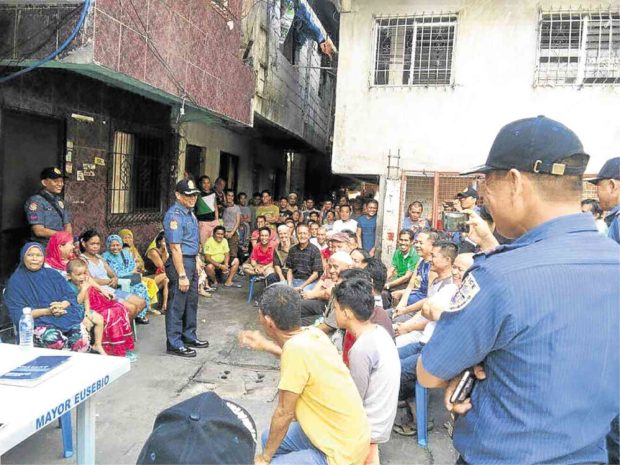 The EPD led by Chief Supt. Romulo Sapitula (center) gathers members of the Muslim community in Barangay Sto. Tomas, Pasig City, for a dialogue on May 29. —Photo courtesy of EPD