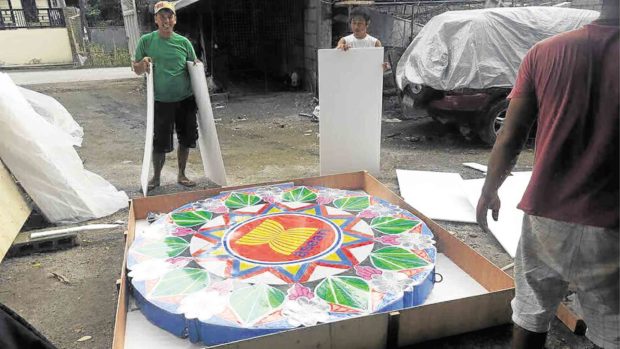 Pampanga craftsmen pack a “parul” (Christmas lantern) that will be displayed as the country hosts the Association of Southeast Asian Nations summit. —CONTRIBUTED PHOTO