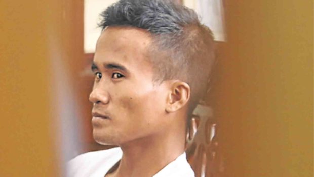 Construction worker Carmelino Ibañez inside a police station in San Jose del Monte City, Bulacan province, after confessing to the massacre of members of the Carlos family and being addicted to drugs. Tests, however, showed he was negative for drug use. —INQUIRER PHOTO