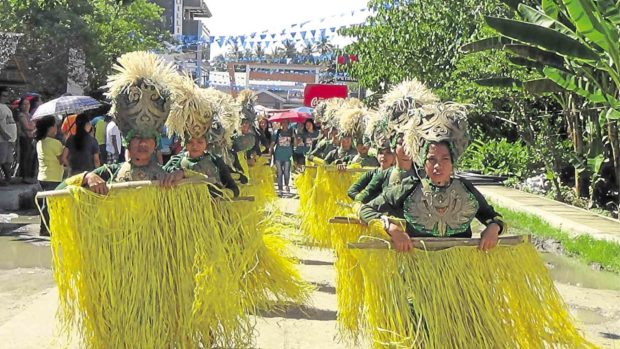 Though their town still reels from the April 10 attack by Abu Sayyaf, Inabanga villagers take part in a street dancing competition for the town’s Raffia Festival. —LEO UDTOHAN