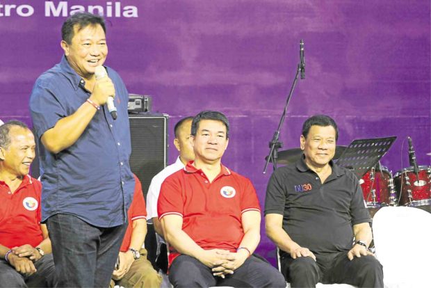 President Duterte, PDP-Laban chair, shares the stage with administration party leaders (from left) Energy Secretary Alfonso Cusi, Speaker Pantaleon Alvarez and Senate President Aquilino Pimentel III during the PDP-Laban’s 35th anniversary celebration in March.  —MALACAÑANG PHOTO