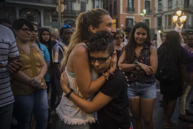Woman hugs Muslim boy - Las Ramblas - Barcelona - 21 Aug 2017