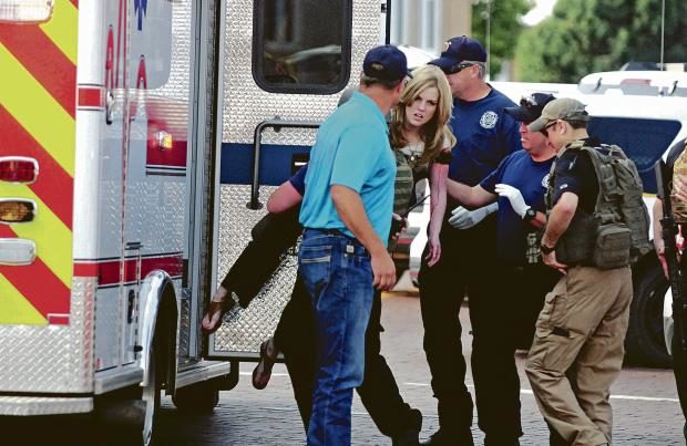 Wounded woman carried into ambulance in New Mexico - 28 Aug 2017