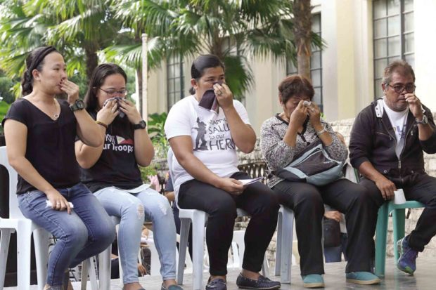 Gaudencia and Dominador Nazareno (second and third from left), parents of SWAT officer Rey Anthony Nazareno, during ceremonies honoring their son and three other Bohol heroes in Cebu City —JUNJIE MENDOZA/CEBU DAILY NEWS