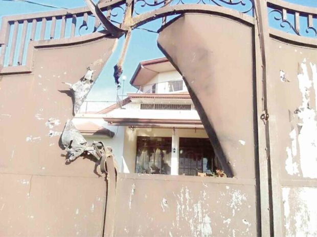 Aside from an Islamic school, this house in Matanao town was also hit by mortar fire that punched a hole on its gate. The stray mortar round was fired by terrorists still holed up in Marawi, according to the military. —DRIES ABATO LININDONG