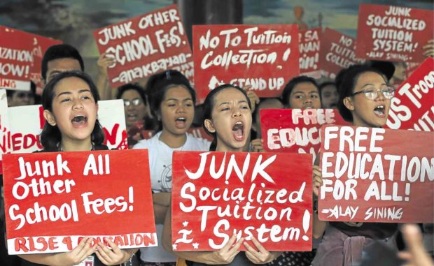 UP Diliman students protest the collection of school fees on the same day the UP president announced that no fees would be collected this semester. —EDWIN BACASMAS