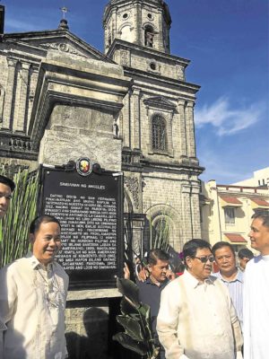 A marker is installed at Holy Rosary Church in Angeles City, site of the first anniversary celebration of Philippine Independence, to correct historical accounts. —TONETTE T. OREJAS