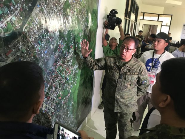 Western Mindanao Command chief Lt. Gen. Carlito Galvez shows the remaining battle area in Marawi City using a map of the city. Allan Nawal