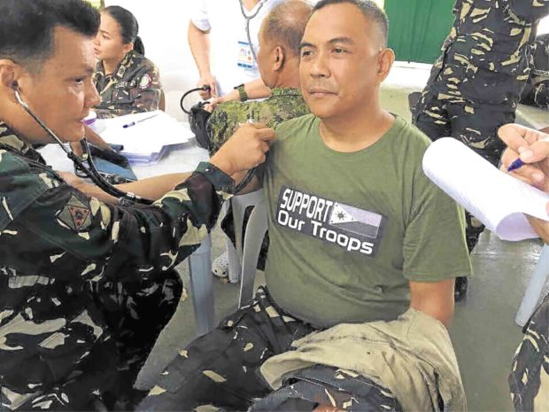 An Army soldier was one of at least 150 people who donated blood for wounded soldiers in Marawi City during an event hosted by the Southern Luzon Command in Lucena City. —CONTRIBUTED PHOTO