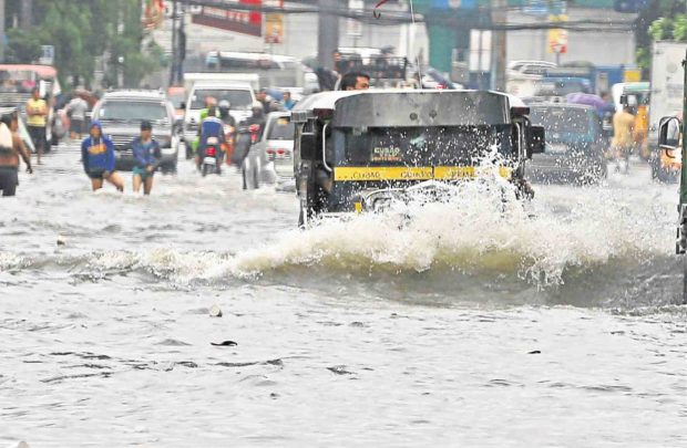 water-proof A passenger jeepney makes like an amphibious vehicle to get through a flooded portion of E. Rodriguez Sr. Avenue in Quezon City. Rains brought by Tropical Depression “Maring” lashed Metro Manila on Tuesday, leaving some areas underwater.  —EDWIN BACASMAS