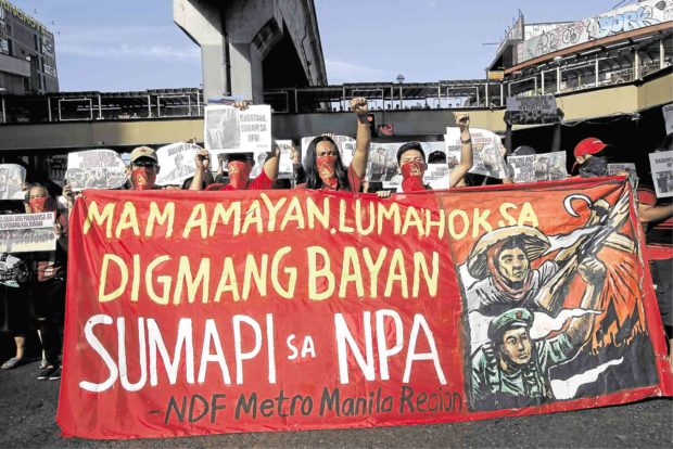 Communist rebels, like the ones who held a lightning rally in Quezon City in March, were among the targets for intelligence gathering by a network of village spies that police are building. —EARVIN PERIAS