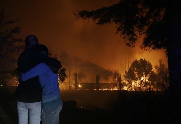 Women hug watching California fire - 9 Oct 2017