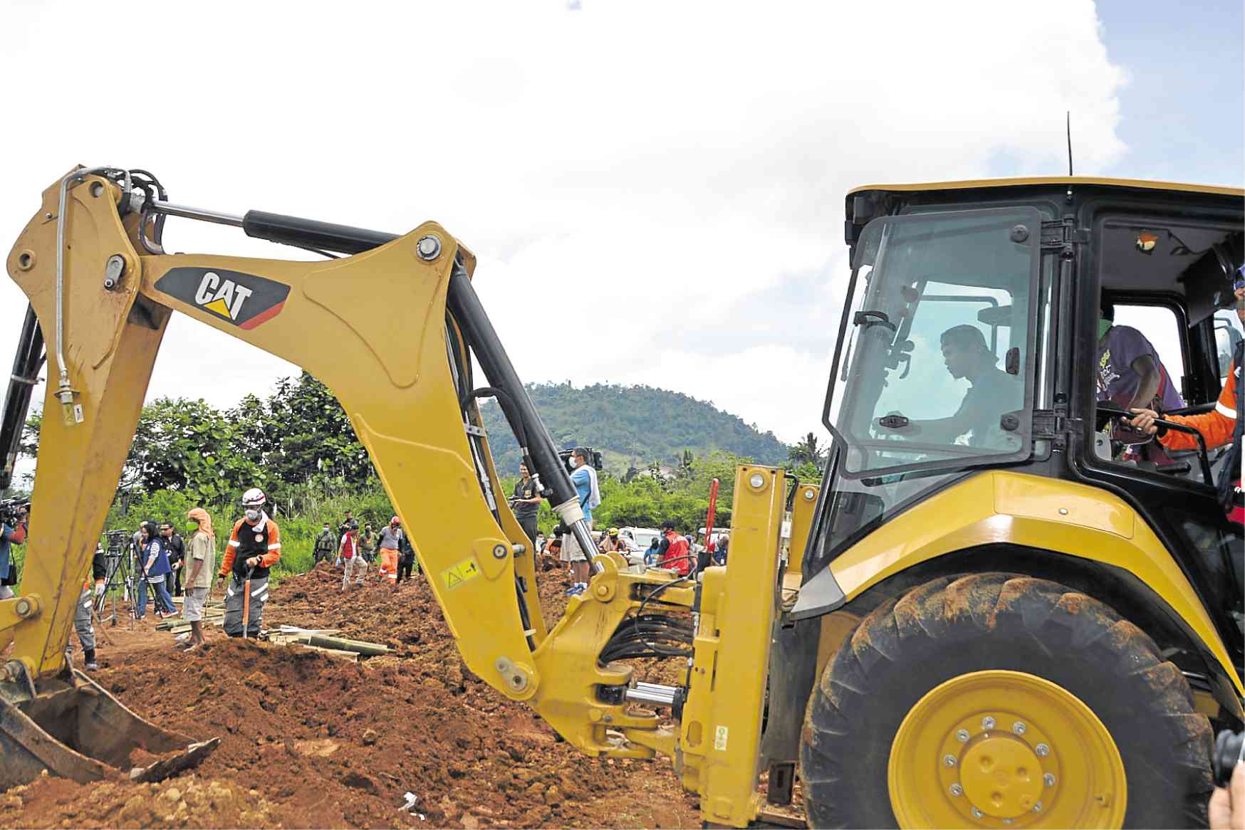 Backhoe operator Digging graves for Marawi dead 'kind of eerie