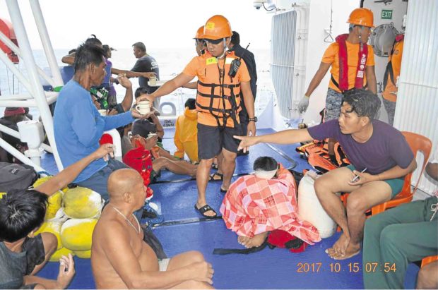 Some of the rescued fishermen aboard the Coast Guard vessel BRP Capones 4404. —PHOTO COURTESY OF PCG ZAMBOANGA