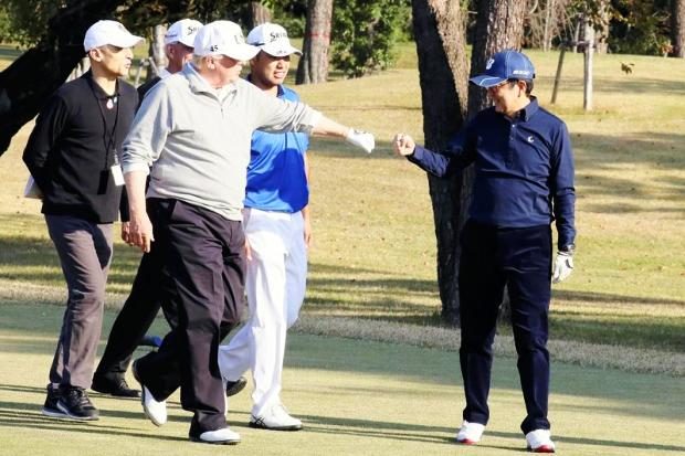 Donald Trump and Shinzo Abe on golf course - 5 November 2017
