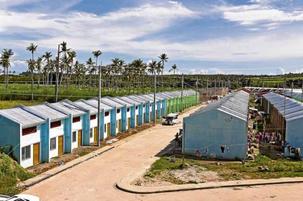 OCCUPIED Survivors of Supertyphoon “Yolanda” have started to occupy units in the National Housing Authority project in Barangay May in northern Cebu’s Daanbantayan town. —JUNJIE MENDOZA/CEBU DAILY NEWS