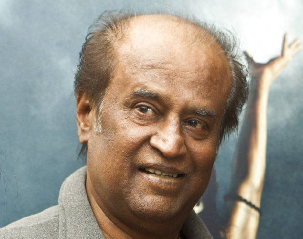 FILE - In this March 31, 2012, file photo, Indian actor Rajinikanth poses at a photo call for "Kochadaiyaan: The Legend" at a west London hotel. Movie superstar Rajinikanth, 67, said Sunday, Dec. 31, 2017, he plans to launch his own party, calling it his duty. The actor said to his cheering supporters his objective is to change the system and bring good governance to his native state of Tamil Nadu.