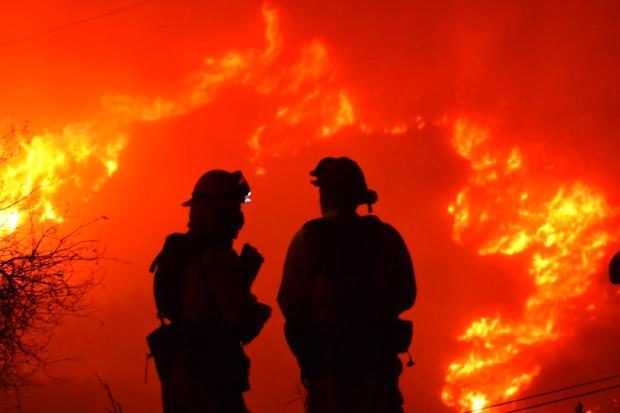Firefighters in silhouette in California - 10 Dec 2017