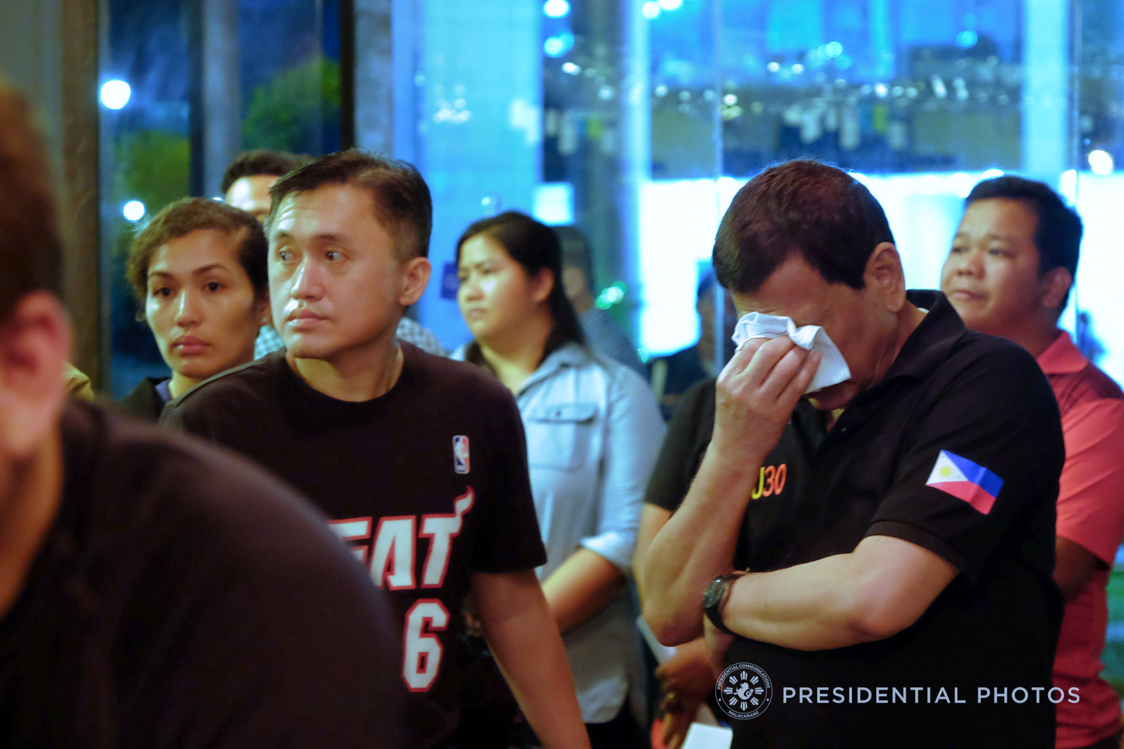 President Rodrigo Roa Duterte weeps upon hearing the news that the victims who were trapped inside the NCCC Mall Davao may have zero chance of survival as the fire inside the mall continues to rage as of dawn of December 24, 2017. Also in the photo is Special Assistant to the President Christopher Lawrence Go. KIWI BULACLAC/PRESIDENTIAL PHOTO