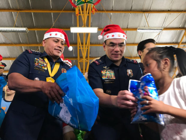 Philippine National Police (PNP) chief Director General Ronald "Bato" Dela Rosa giving gifts at a gift-giving program. Photo by Ryan Leagogo/INQUIRER.net