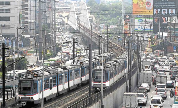 LINE OF SIGH Spotty maintenance and other problems plaguing Metro Rail Transit 3 continue to derail moves to improve mass transport on Edsa. —EDWIN BACASMAS