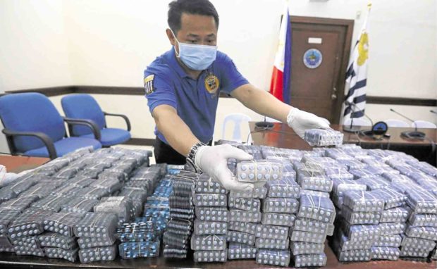 Some of the seized illegal drugs from Pakistan are turned over by the Bureau of Customs to the Philippine Drug Enforcement Agency. —MARIANNE BERMUDEZ