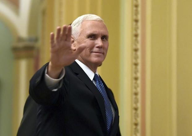 Pence tour of migrant center shows men crowded in cages