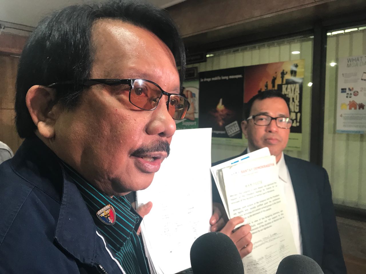 VACC founding chair Dante Jimenez (left), together with lawyer Manuelito Luna (right), submits a report before the Office of the Solicitor General containing a manifesto with more than a thousand signature backing extension of martial law in Mindanao. INQUIRER.net / JHOANNA BALLARAN
