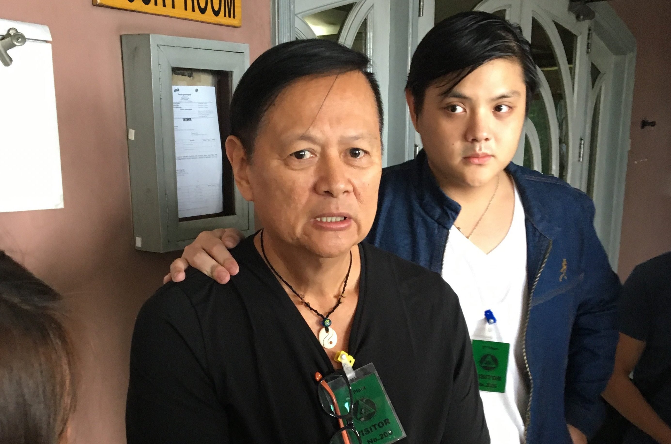 Former Palawan Governor Joel Reyes, joined by his son, attend the Sandiganbayan's hearing on the Ombudsman's motion to have him rearrested for being a flight risk. File Photo: Vince F. Nonato.
