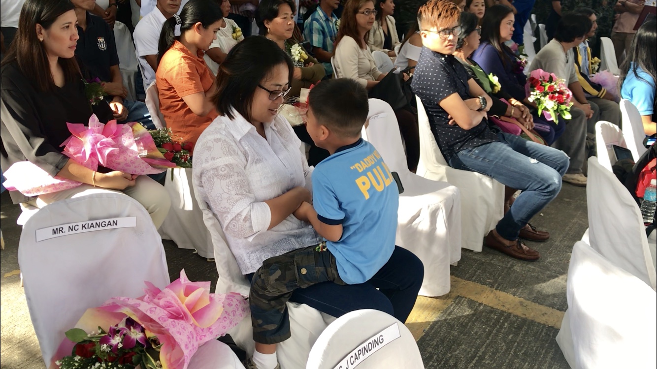 Late PO3 Noble Kiangan’s wife Christine and four-year-old son and namesake. Julliane Love de Jesus/INQUIRER.net