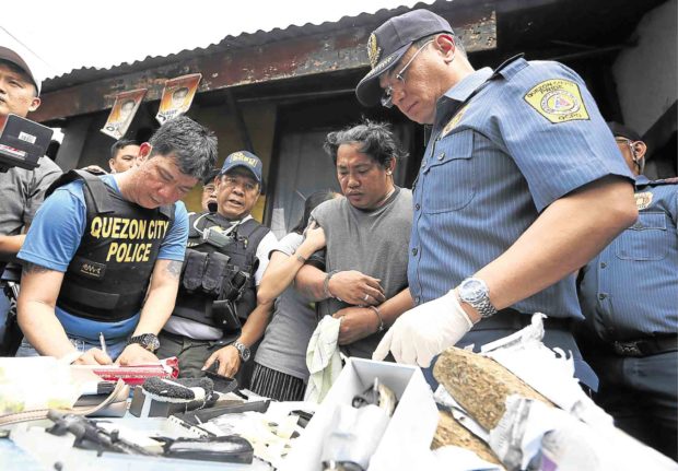 NO SHOTS FIRED A daytime drug raid conducted by the police on Feb. 2 with media crews in tow seizes packets of “shabu” (crystal meth) and marijuana from a suspected drug peddler in Barangay Krus na Ligas, Quezon City  —NIÑO JESUS ORBETA