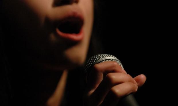 Girl singing on microphone