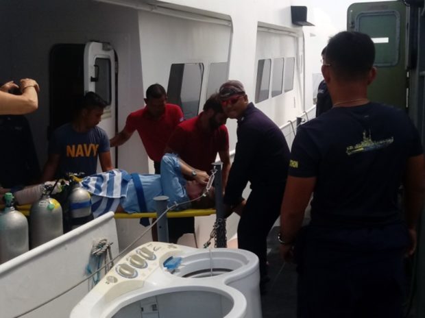 The Philippine Navy (BRP Nestor Reinoso) assists in the evacuation of an American national who fractured a knee in a yacht cruising near Tubbataha Reef. /Wescom