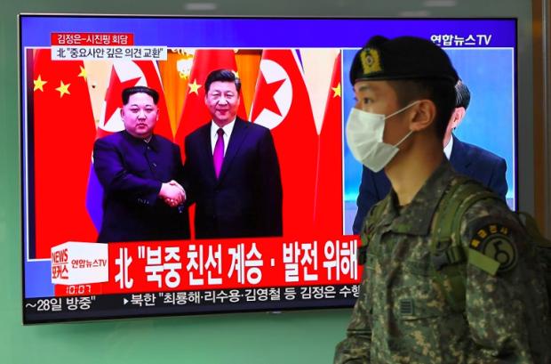 Xi Jinping and Kim Jong-Un on TV screen in SKorea - 28 March 2018