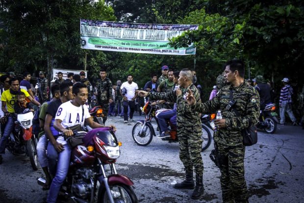 Moro Islamic Liberation Front (MILF) members secure Camp Darapanan in Sultan Kudarat, Maguindanao on the southern island of Mindanao on July 29, 2018. Nearly 100,000 members of the Philippines' largest Muslim rebel group gathered on July 29 to discuss a landmark law granting them autonomy, expressing hope it would make their "dream of peace" a reality. / AFP PHOTO / FERDINANDH CABRERA
