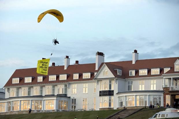 Paragliding protester in Scotland