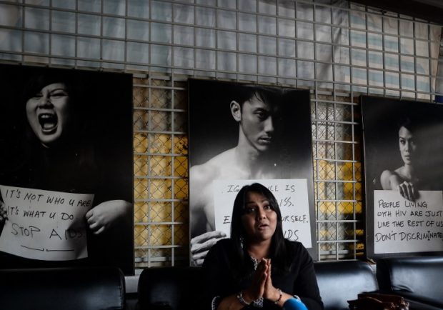 (FILES) In this file picture taken on May 12, 2016, Malaysian transgender woman Nisha Ayub gestures during an interview with AFP in Kuala Lumpur. The Malaysian government came under fire on August 9, 2018 for ordering the removal of LGBT activists' portraits from an exhibition, with campaigners labelling it an attack on the "dignity" of the homosexual community.   / AFP PHOTO / Manan VATSYAYANA