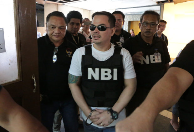 PHOTO: Kerwin Espinosa with NBI agents STORY: CA reopens Kerwin Espinosa drug, gun cases