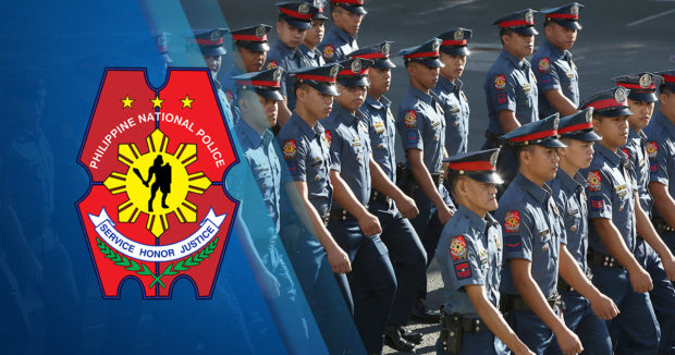 Police officers march at the Philippine National Police grounds in Camp Crame in Quezon City. STORY: PNP only has one lawyer for every 1,400 cops